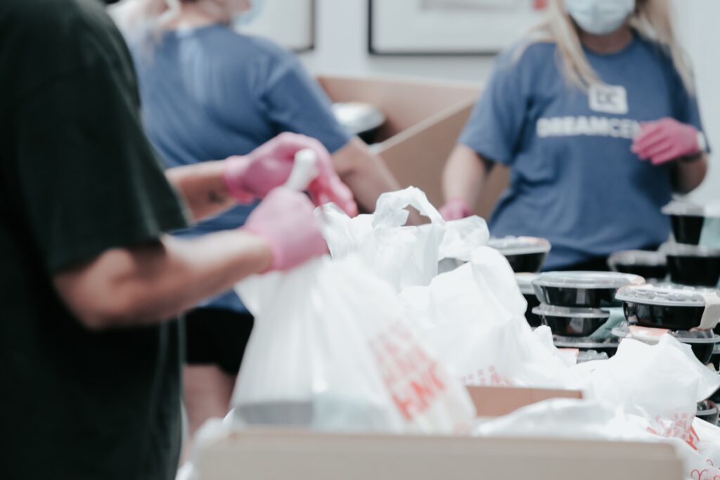 volunteers-distributing-bags-of-food