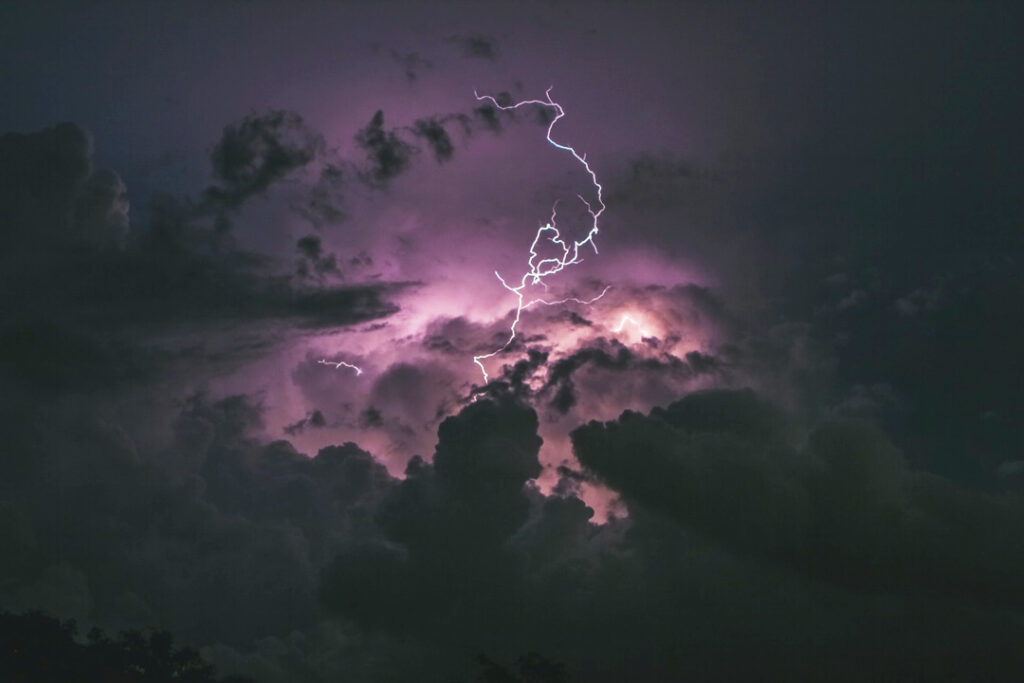 lightning-strike-through-dark-purple-sky