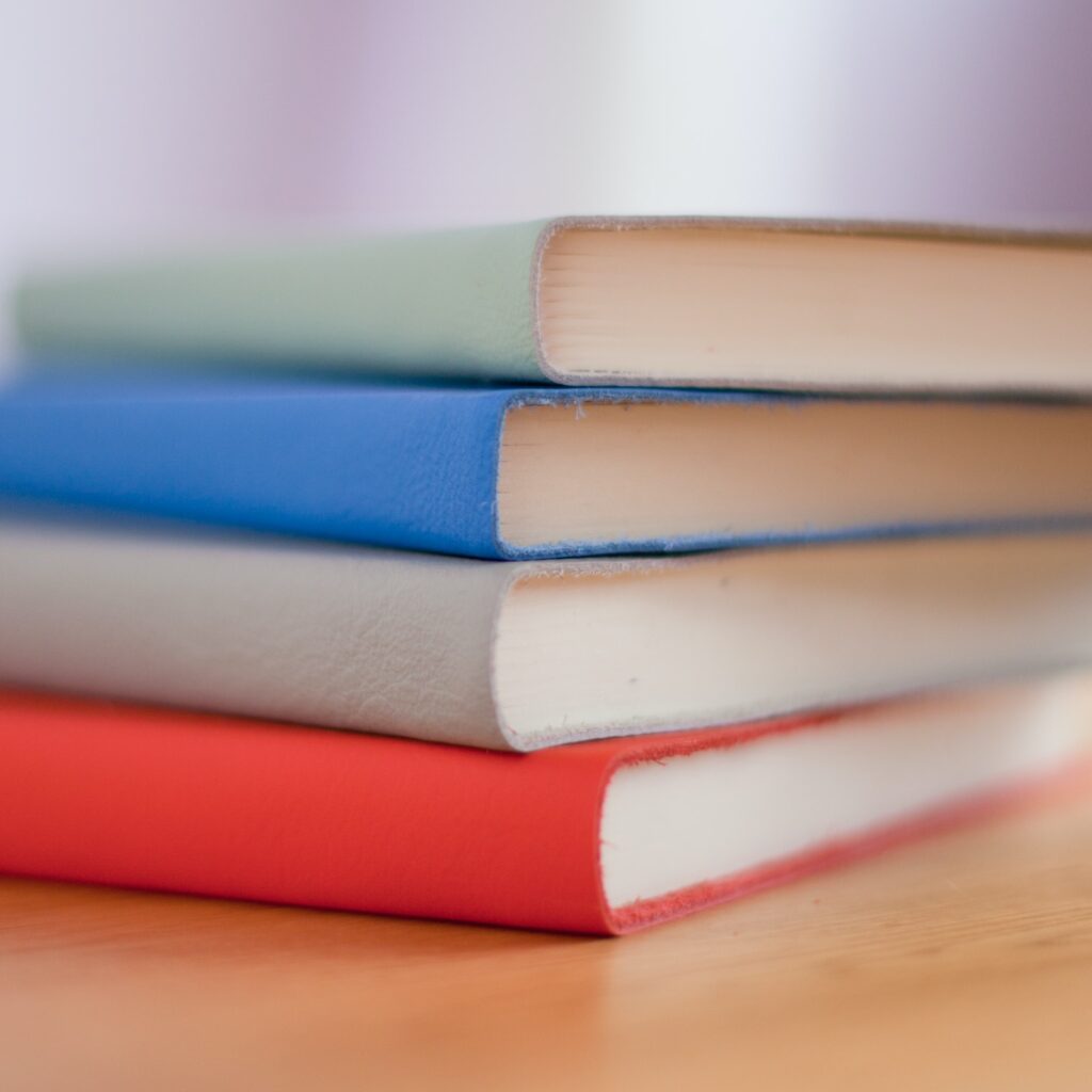 stack-of-multicolored-harcover-books