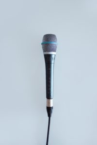 microphone against a pale blue background