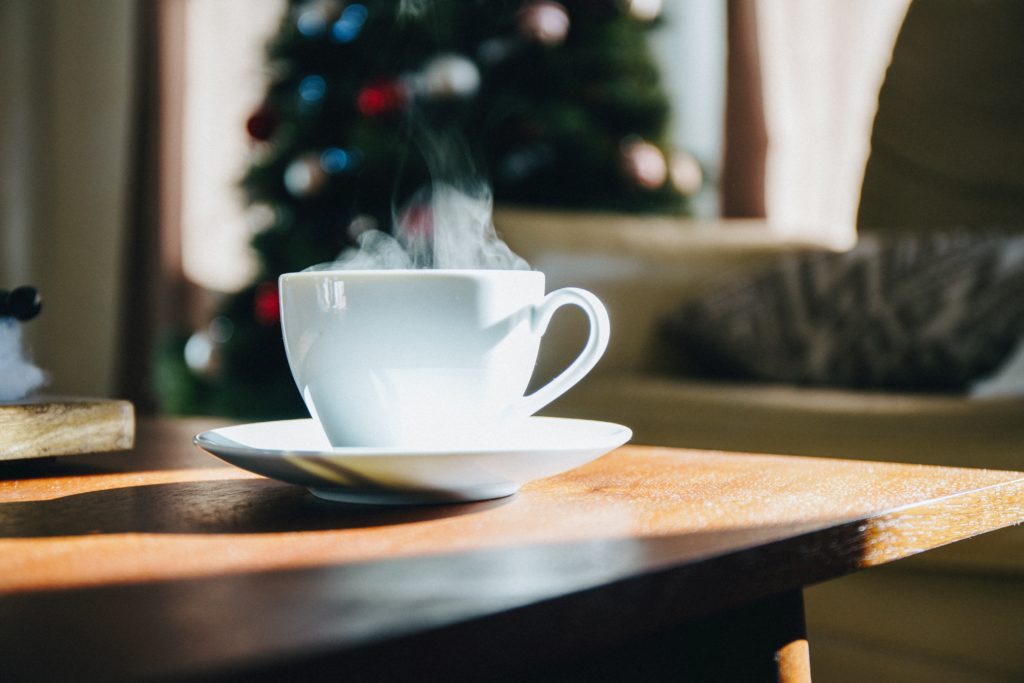 steaming-coffee-on-table-with-holiday-decor