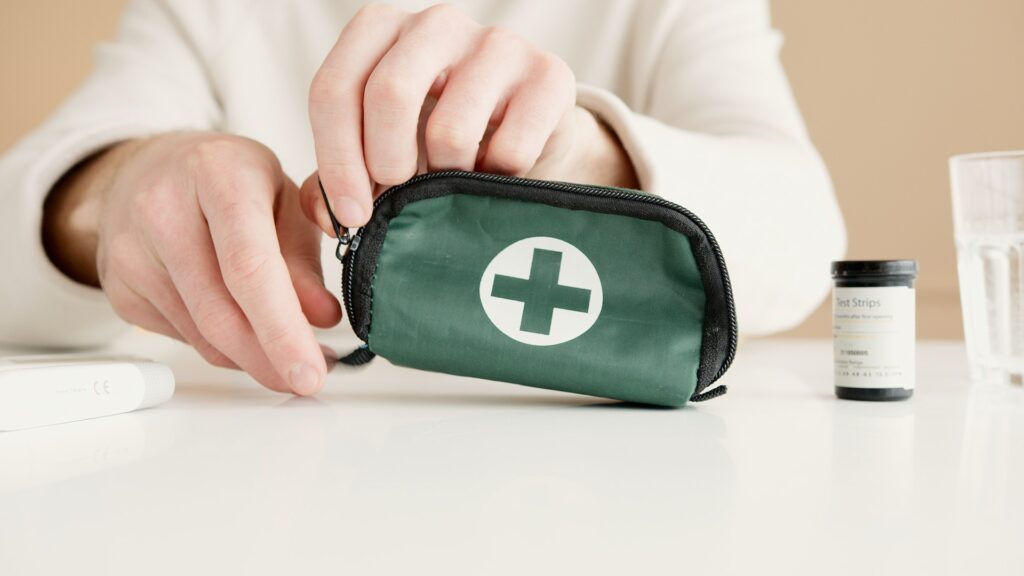 person-opening-green-emergency-kit